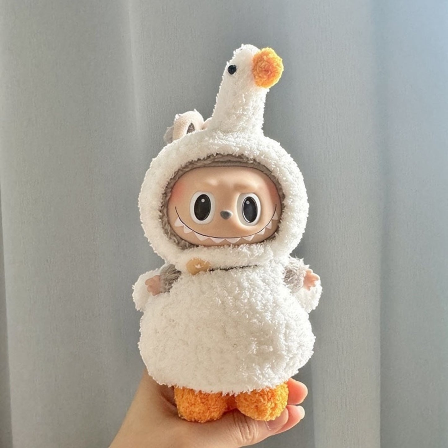 Transform your Labubu doll into a quacky cutie with this handmade Cute Duck costume outfit! Compatible with Labubu versions 1, 2, and 3, this outfit ships worldwide with fast shipping. Labubu figure not included. Let your Labubu stand out with this unique and adorable costume!, Cute-Duck-costume_style_-_Handmand_Labubu_Doll_Outfit