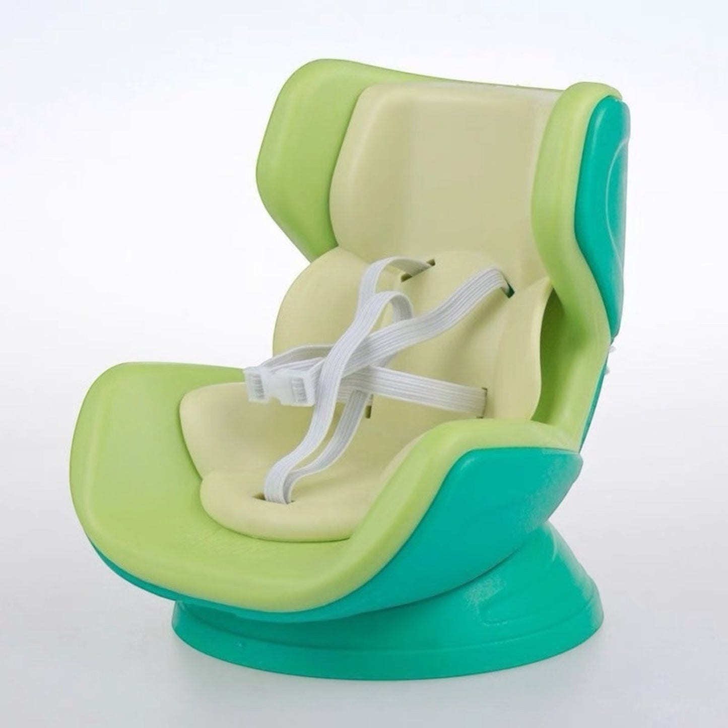 Green and beige baby seat with white straps on a white background