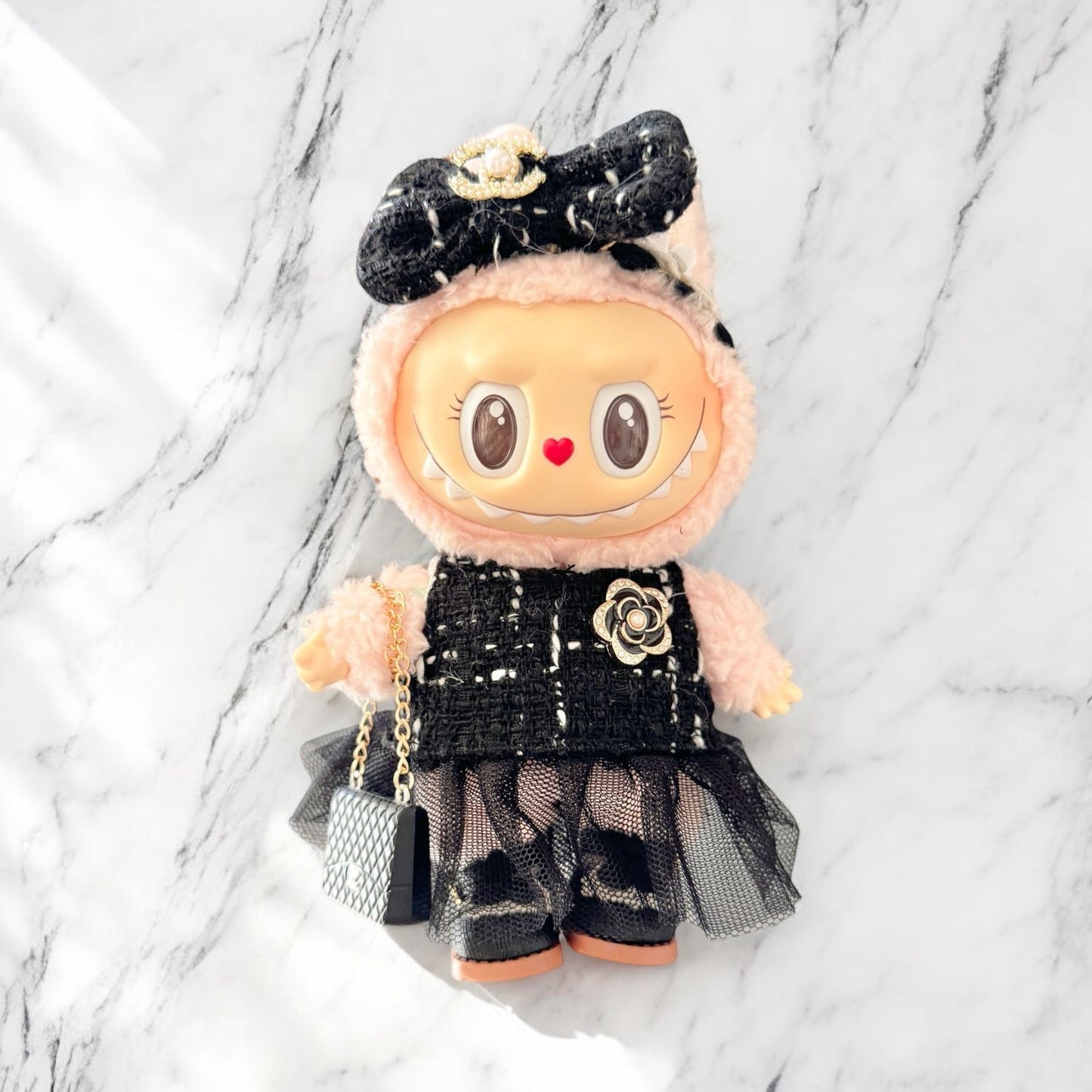 Introducing the Black Dress Style - Handmand Labubu Doll Outfit. With its fancy black dress and cute matching bag, this outfit is sure to make your Labubu version 1, 2, or 3 stand out. Enjoy fast worldwide shipping for this labubu outfit. Please note: Labubu figure not included., Black Dress Style - Handmand Labubu Doll Outfit