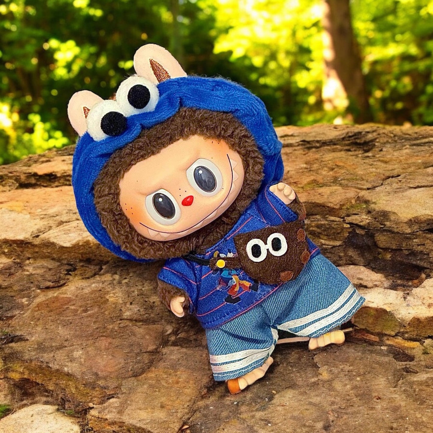 A Blue Cookie Monster Costume outfits on Labubu 17cm Doll with forrest background