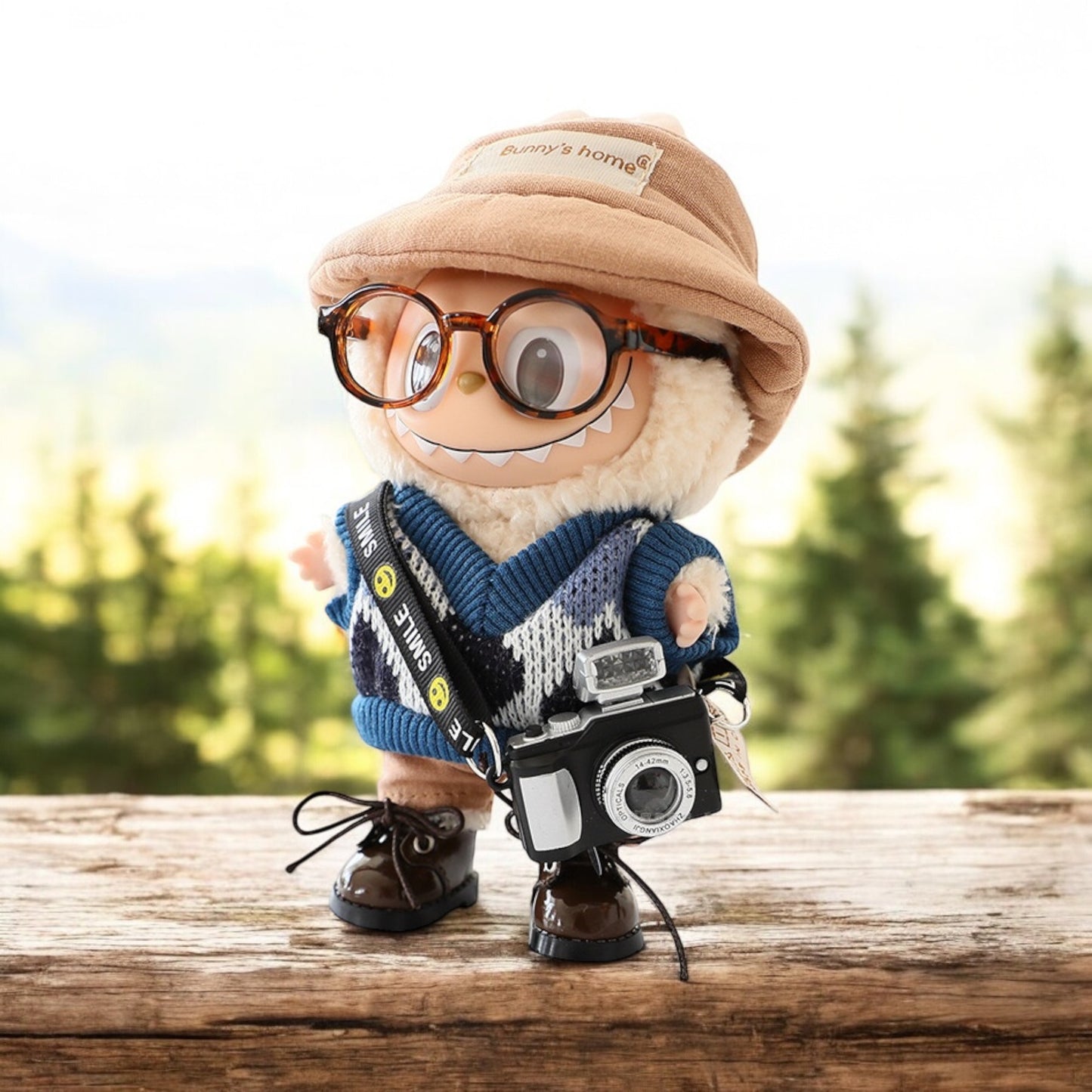 Dress your Labubu doll in style with this handmade outfit! Includes a cute hat, checker cloth, and glasses with a camera for capturing every adventure. Fits Labubu versions 1, 2, and 3. Ships worldwide with fast shipping. Labubu figure not included. Let Labubu's playful personality shine with this unique outfit! Labubu Doll Outfit, Glasses, Camera style - Handmand Labubu Doll Outfit