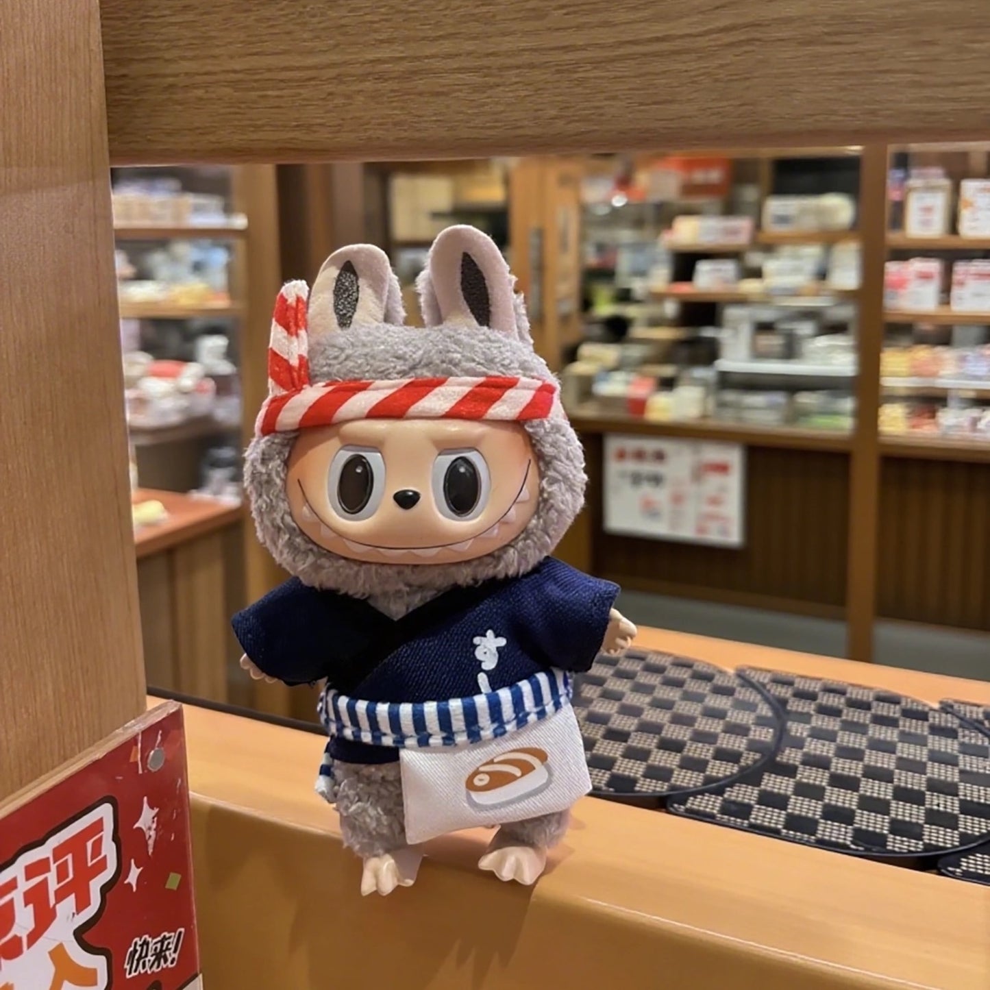 Labubu Doll wearing a Japanese Sushi Chef outfits in the Japan Sushi Shop