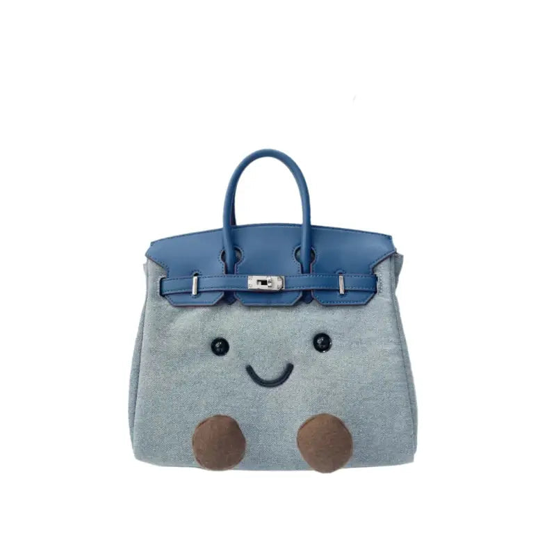 Kawaii denim plush character satchel handbag in cobalt blue – front view with embroidered face