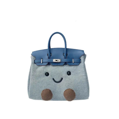 Kawaii denim plush character satchel handbag in cobalt blue – front view with embroidered face