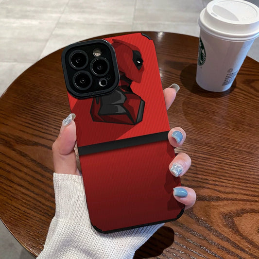 Red iphone case with Dead Pool design held by a hand on a wooden table with a Starbucks cup.