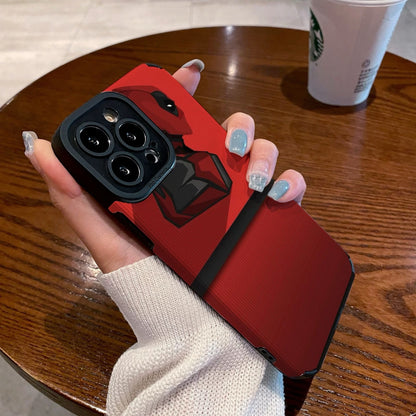 Red iphone case with Dead Pool design held by a hand on a wooden table with a Starbucks cup.