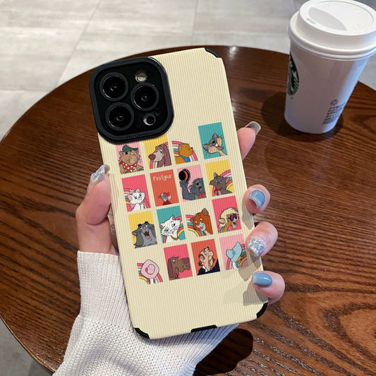 iPhone case with Disney Dogs and Cats character designs held by a person on a wooden table with a Starbucks cup.