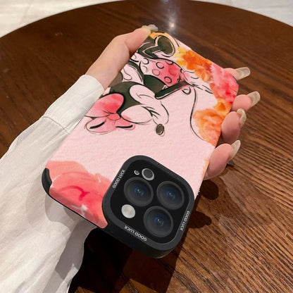 Pink iPhone case with cartoon character Disney Minnie Mouse design held by a hand