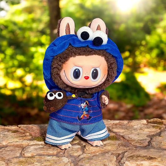 A Blue Cookie Monster Costume outfits on Labubu 17cm Doll with forrest background