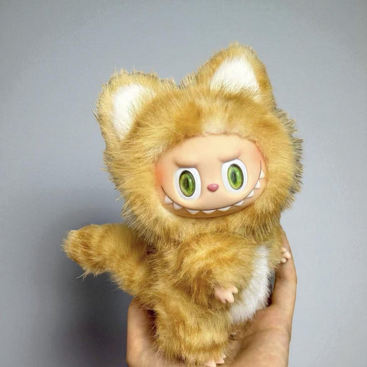 A Labubu Doll wearing a golden cat costume with a gray background
