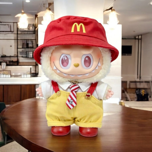 Labubu 17cm Doll Keychain wearing a Fast Food Worker costume with red hat featuring the McDonald's logo on a wooden table.