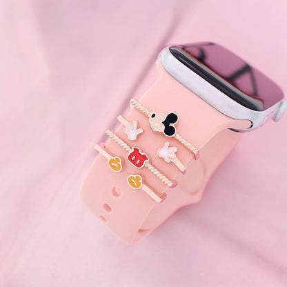 Smartwatch with decorative vintage mickey mouse charms on a pink background