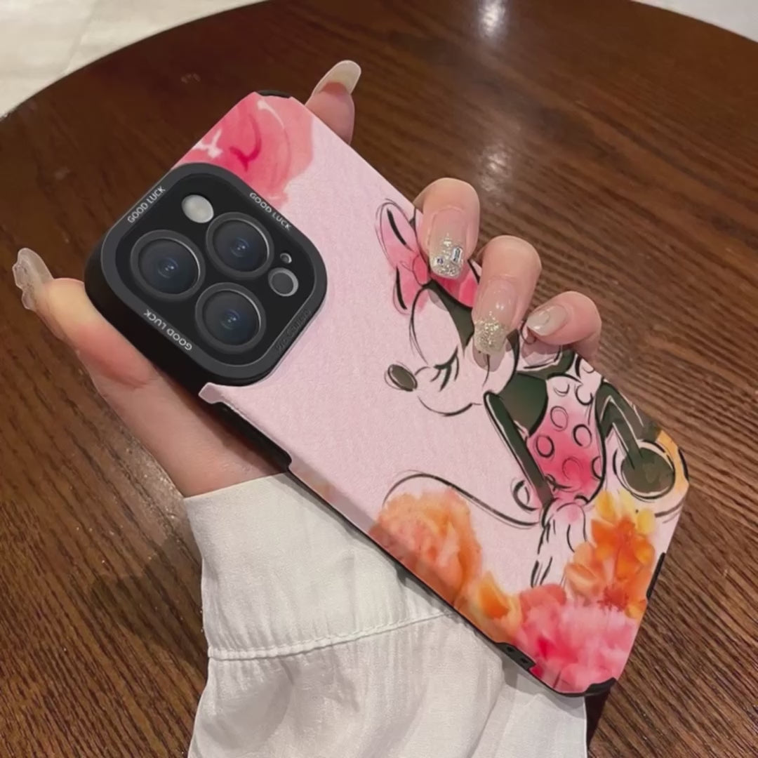 Pink iPhone case with cartoon character Disney Minnie Mouse design held by a hand