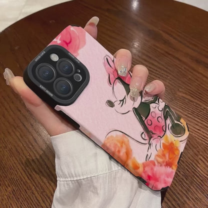 Pink iPhone case with cartoon character Disney Minnie Mouse design held by a hand